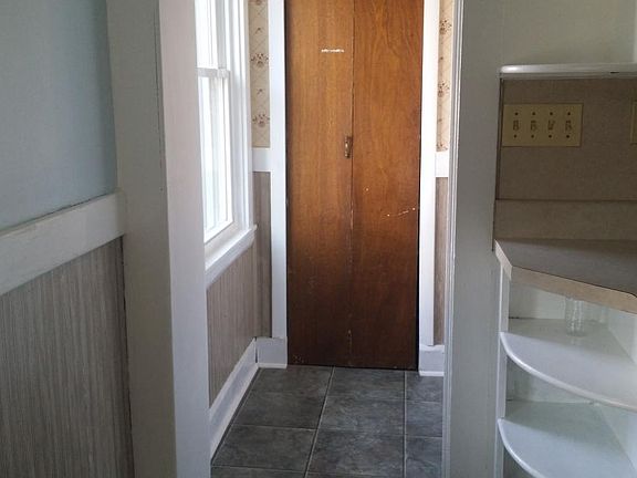 Kitchen pantry closet just inside back entrance