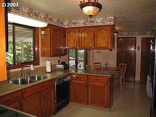 kitchen w silestone counters, loads of cabinets