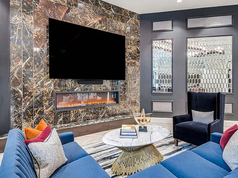 Griffis Frisco resident lounge with fireplace.