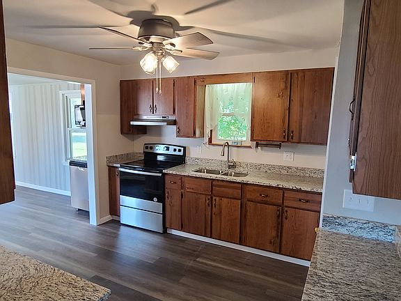 Kitchen with Refrigerator, Electric Smooth Top Stove, Microwave and Dishwasher