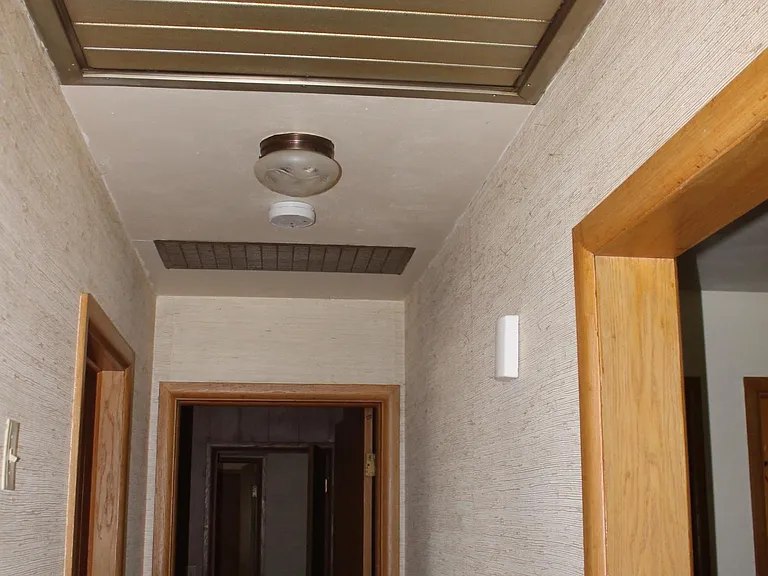 Back hall way with whole house attic fan