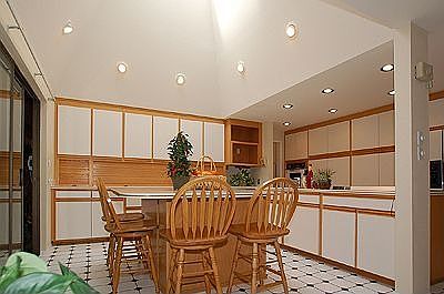 Kitchen with vaulted ceiling, skylight, abundant counter space & island