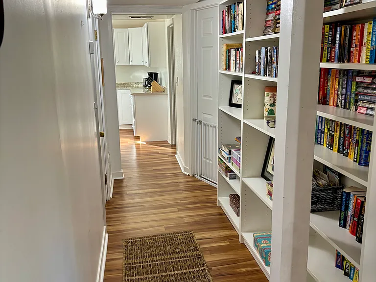 built in book cases with novels, puzzles and plenty of storage