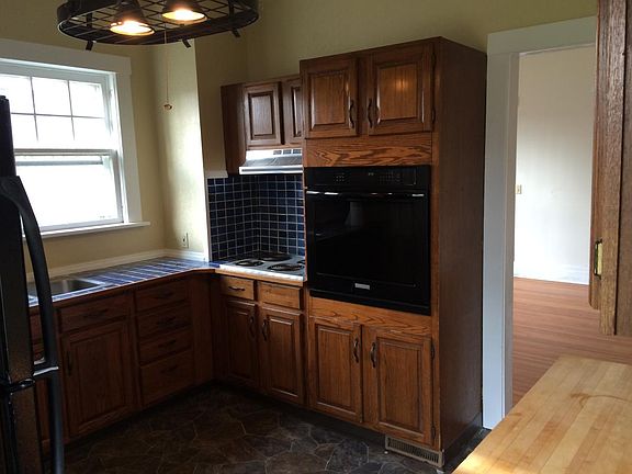 Kitchen: premium oven, electric range, dishwasher, and frig