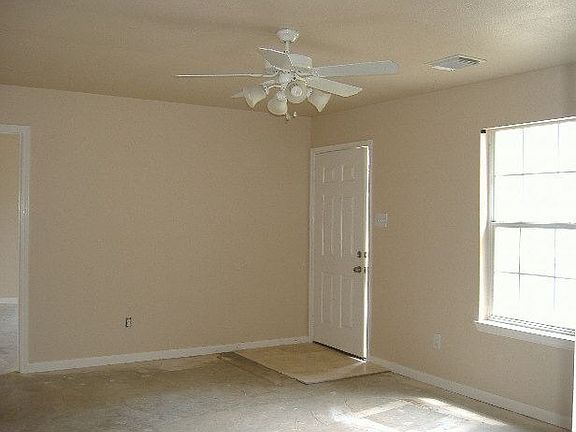 Fresh paint and new ceiling fan in this starter home.