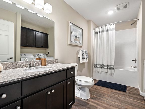 Spacious bathroom with dedicated laundry space
