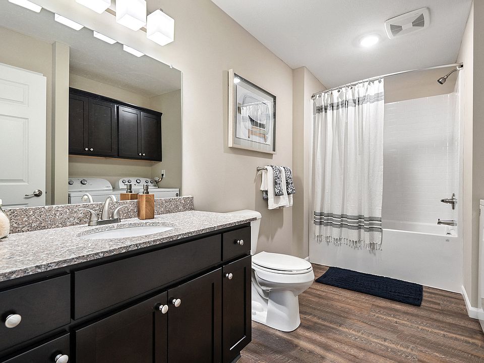 Spacious bathroom with dedicated laundry space