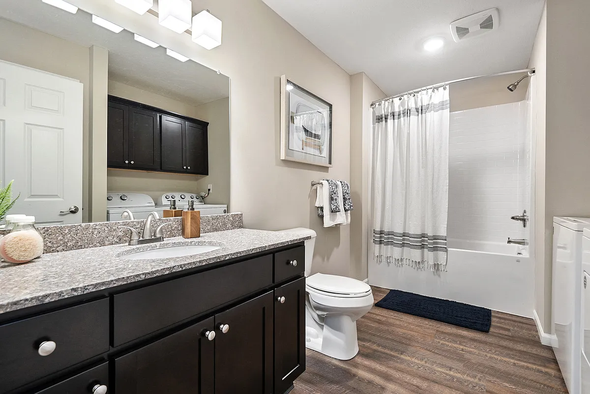 Spacious bathroom with dedicated laundry space - Redwood Texas Township