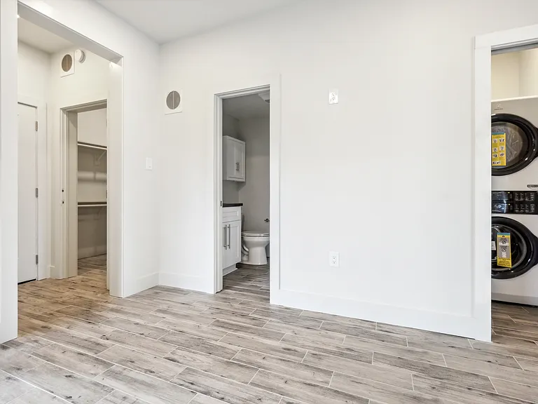 Laundry room, bathroom and walk-in closet.