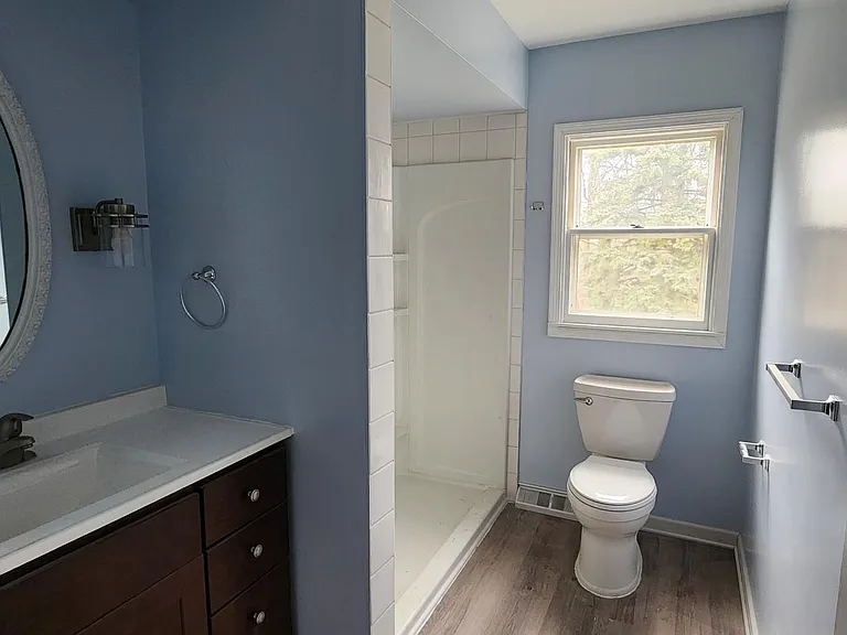 Main full bathroom upstairs. The entire bathroom has been renovated. New shower, toilet, cabinet, sink, etd.