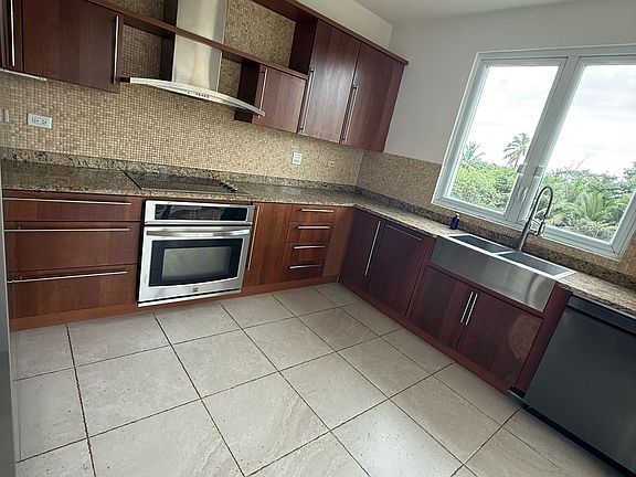 The kitchen includes a dishwasher