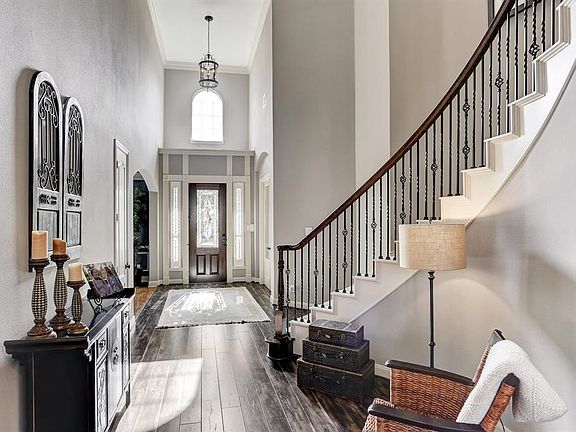 Hardwoods lead you into the family den from the lite up entrance. Room for a reading area by the staircase.