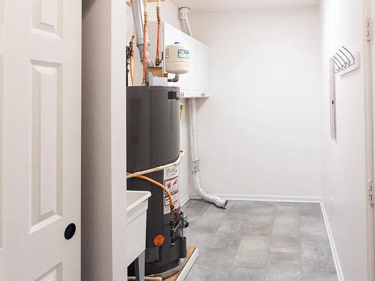 Huge laundry room with cabinet storage space