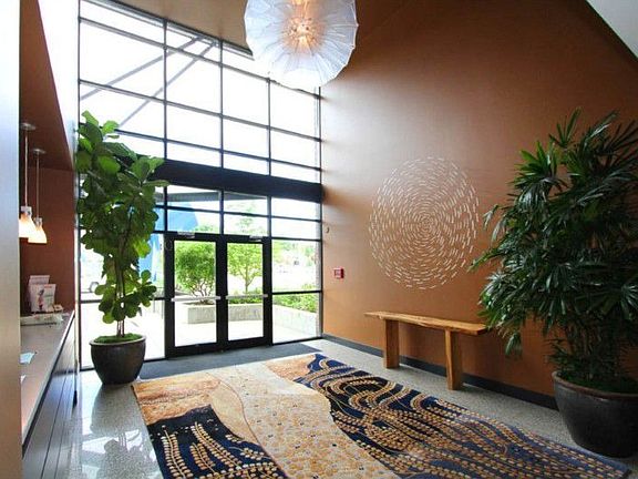 The lobby is full of light, and is where residents pick up the mail, greet visitors and the full-tim