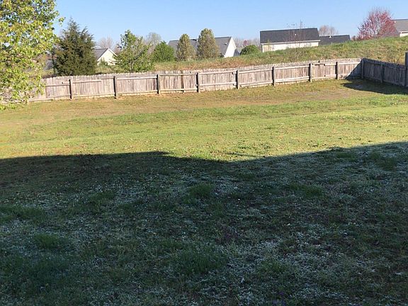 Backyard with tall fence