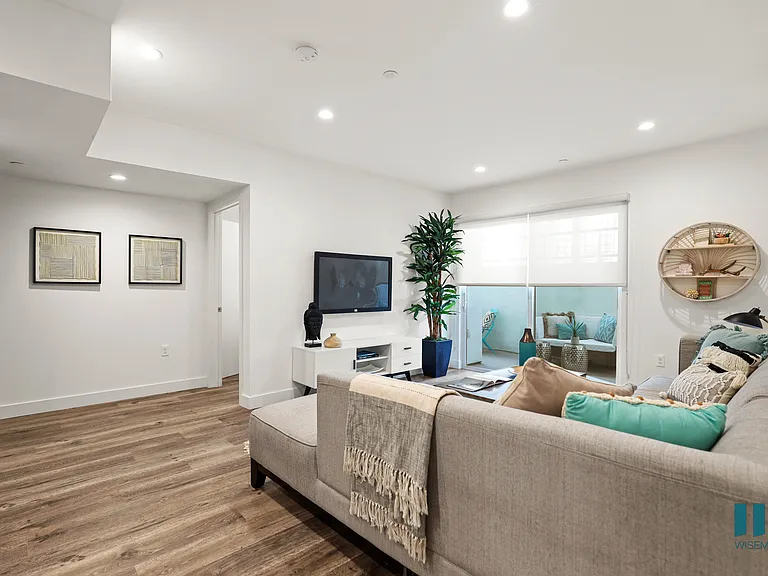 Front Entrance and Living Room with Sliding Glass Doors to Balcony