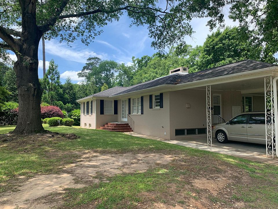 Front of house with carport
