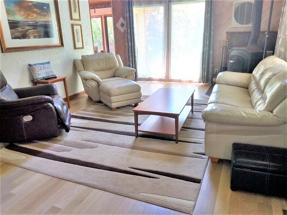 Light filled living room with a vaulted ceiling