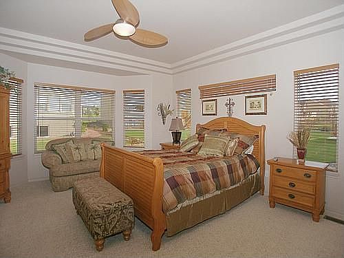 Generous master suite with many bright windows