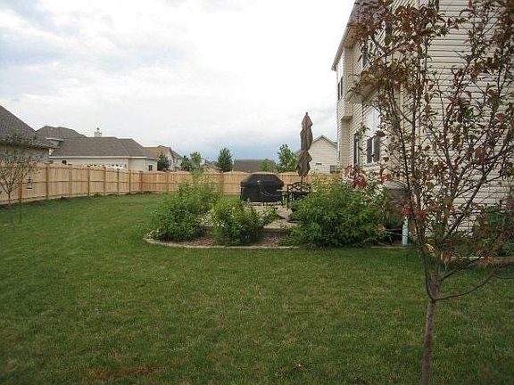 Backyard fully fenced and 2 level stone patio
