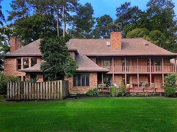 Back of house, large deck and great balcony to view your private backyard.