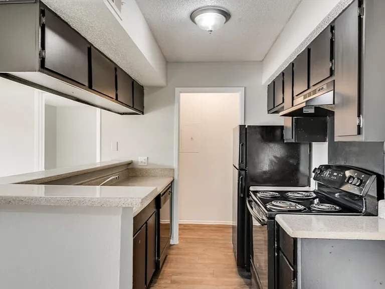 Prepare your favorite meals in a functional kitchen with ample cabinet and counter space.