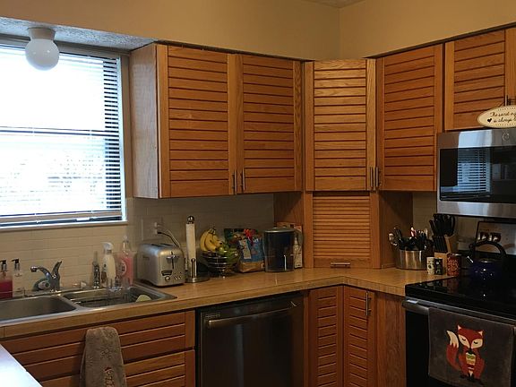 Kitchen with new flooring and updated appliances