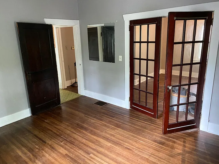 1st bedroom (view of living room through glass doors)