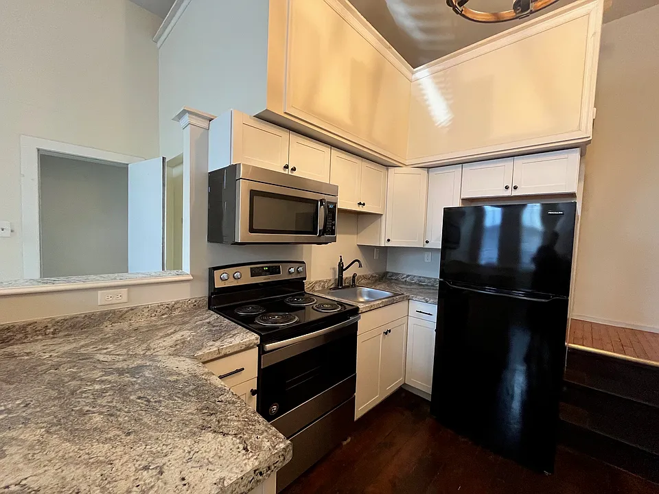 Kitchen with over the range microwave.