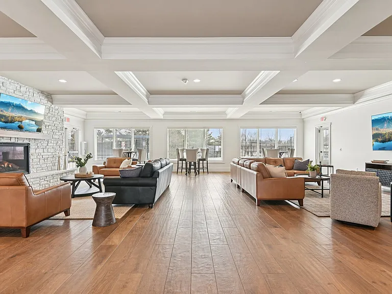 Gather the crew for the ultimate hangout in this expansive clubhouse, featuring a cozy stone fireplace and an elegant coffered ceiling that levels up the vibes.