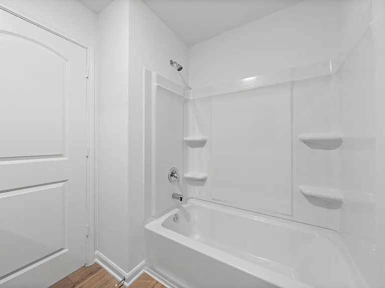 Upstairs bathroom with a shower/tub combination.