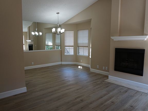 As you walk inside _ vaulted ceilings, natural light, tree top views.