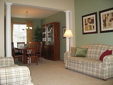 Open formal living room with high ceilings