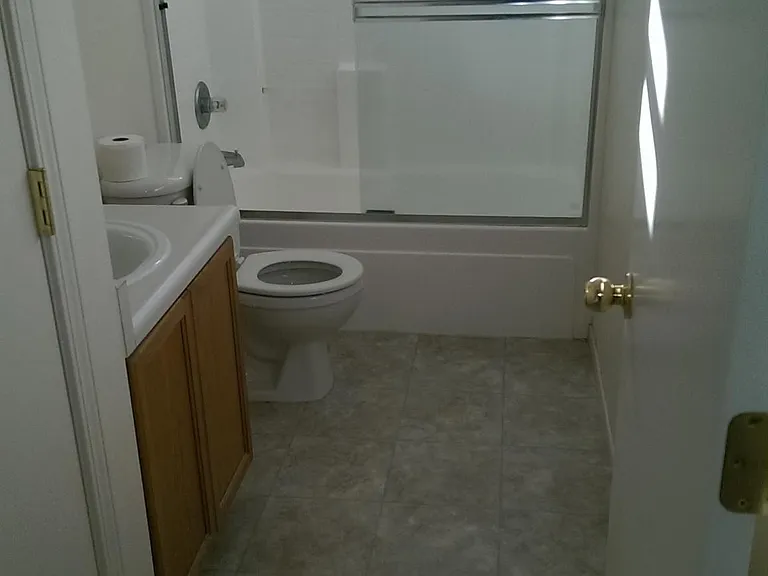 Old photo before new vanity and linoleum.