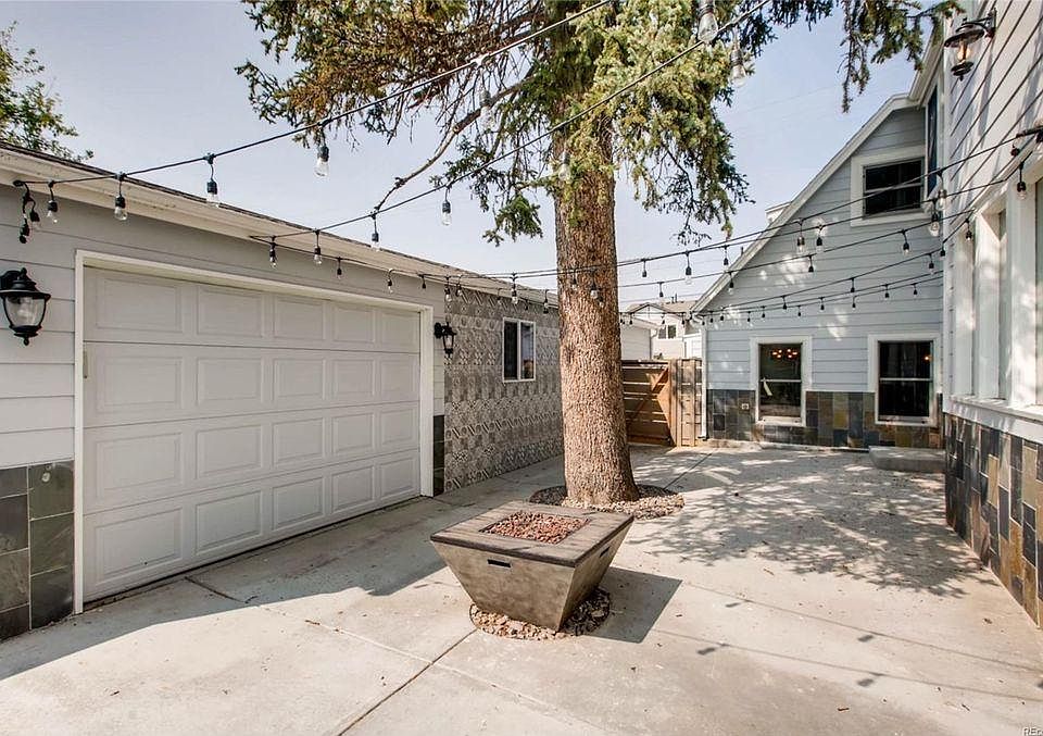 This garage door opens to the breezeway (not car accessible garage). Multipurpose - been used a storage, gym, outdoor living & bar.