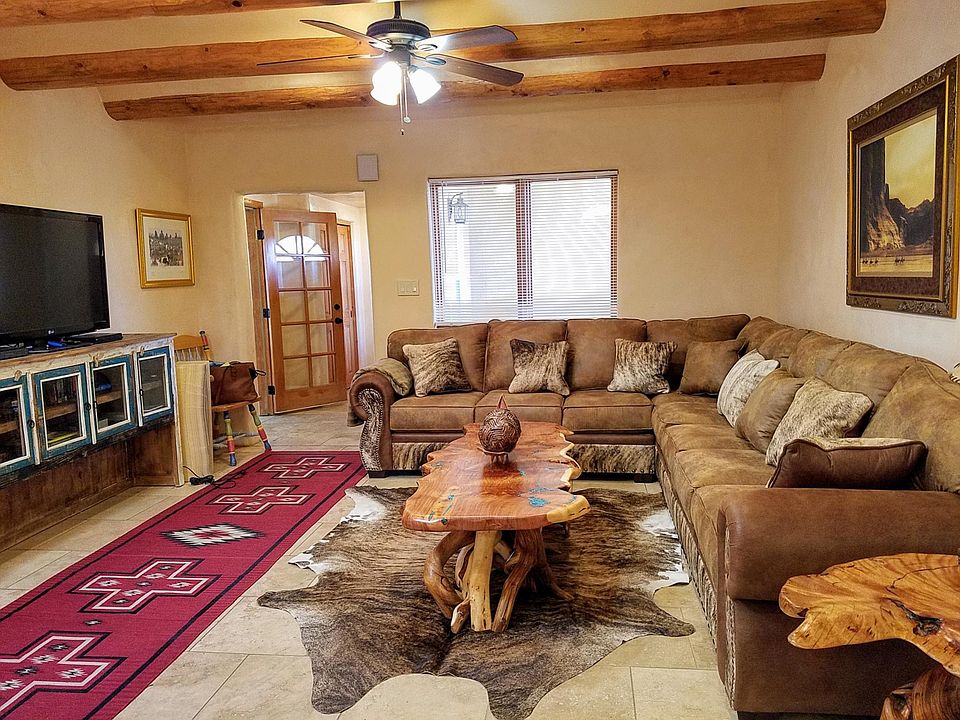 Large living room with coffee table and large screen TV