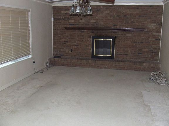 22x14 Den with brick fireplace.