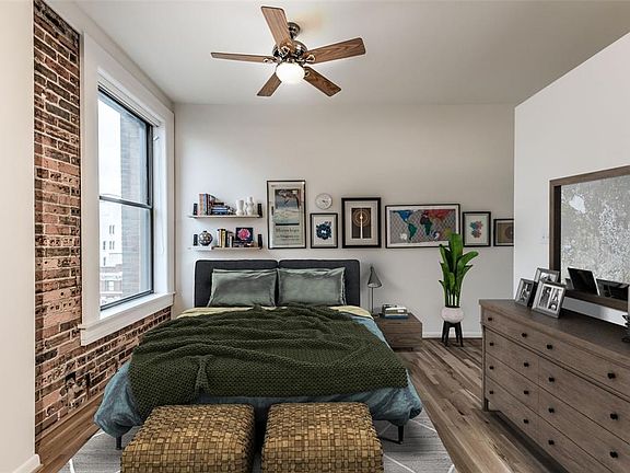 A view of the open secondary bedroom. This photo is virtually staged.