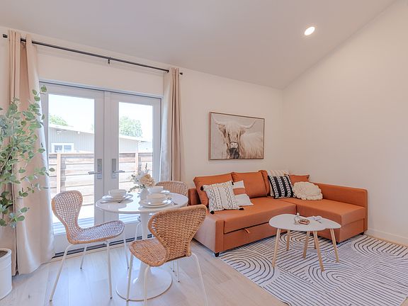 Kitchen and living area, with high cathedral ceiling and lots of natural light.
