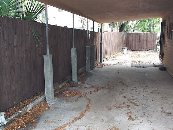 XL carport with side door entrance