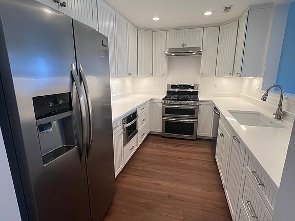 Renovated kitchen with quartz countertops