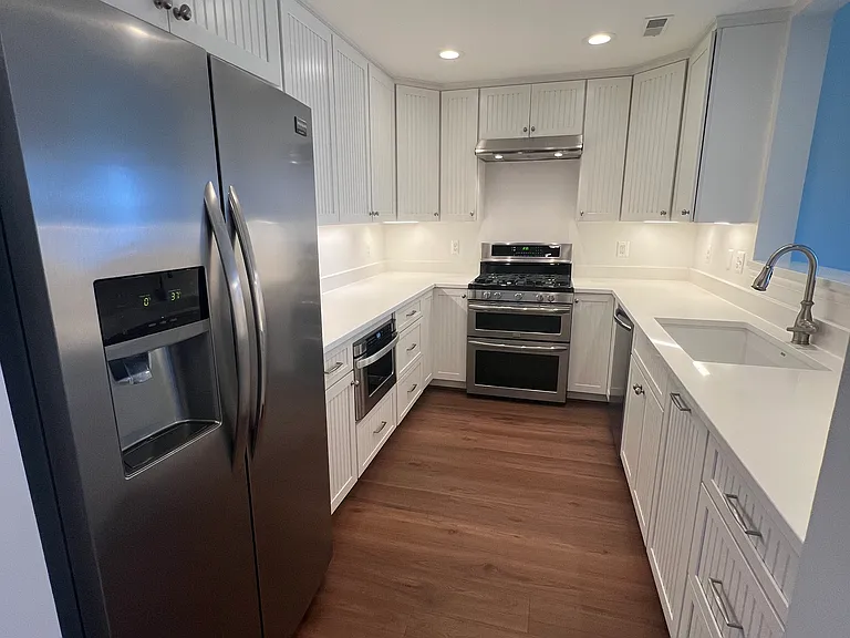 Renovated kitchen with quartz countertops
