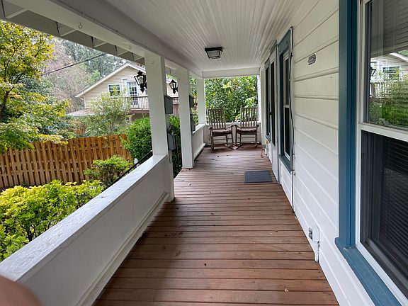 relax on the covered porch with rockers. laundry room is at the far end of the porch.