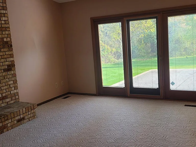 Real Fireplace. Back Sliding doors.