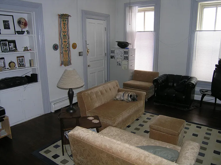 Living room looking North. The door is the entry door for the apartment.