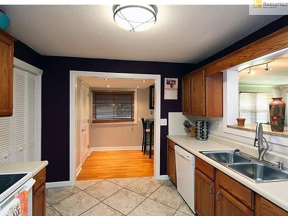 Kitchen opens to Dining.  Laundry just off Kitchen