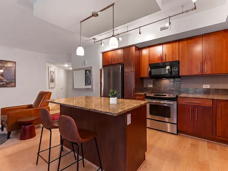 Enjoy your morning coffee or a casual meal at the spacious granite island with comfortable bar seating.