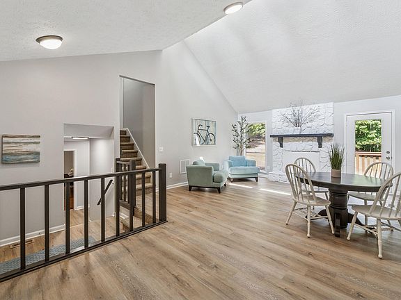 Spacious living area showing stairs going up.