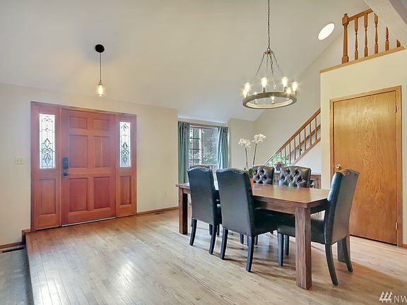 Entry opens to soaring ceilings, open floor plan and expansive hardwood flooring!