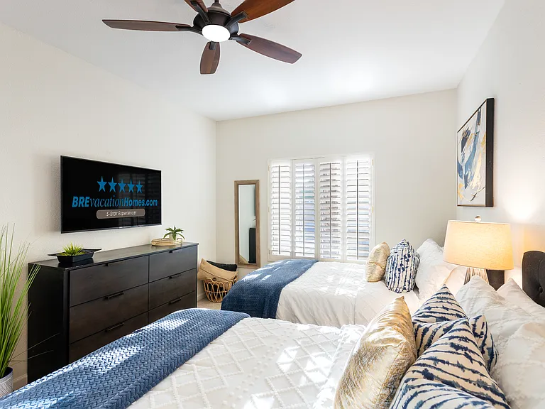 Bedroom 4 of 4: Dresser, 50" Smart TV, 2 Queen Size Beds